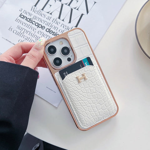 Capa para iPhone em couro dourado rosa H