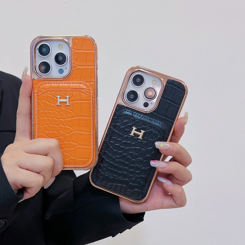 Capa para iPhone em couro dourado rosa H