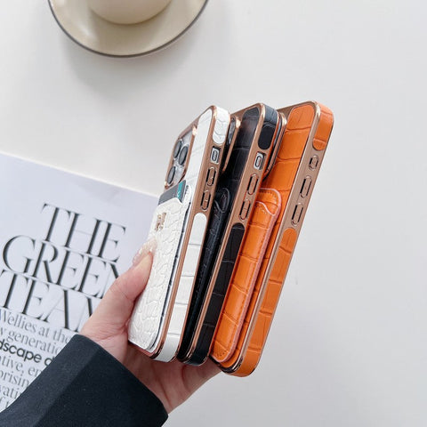Capa para iPhone em couro dourado rosa H