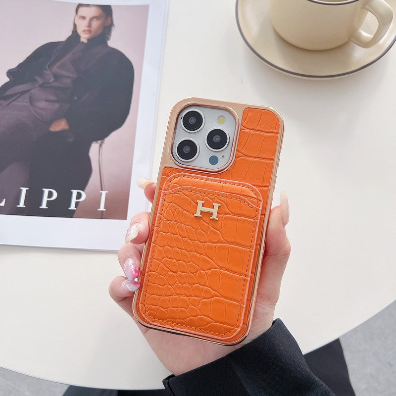 Capa para iPhone em couro dourado rosa H