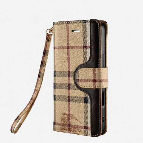 Beige check flip iPhone case with matching wrist strap on light gray background
