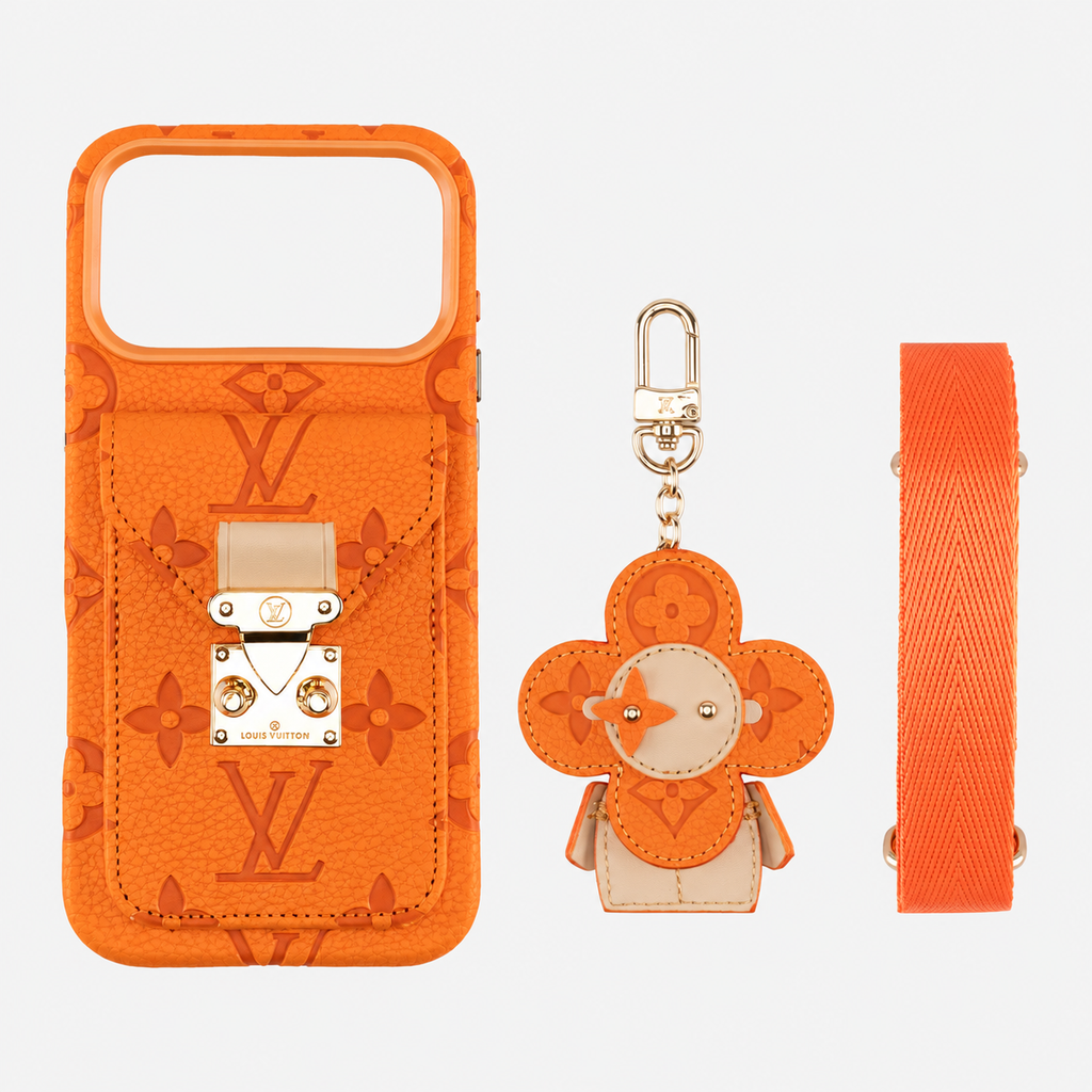 Orange monogram iPhone case with pocket, flower charm and shoulder strap on light gray background